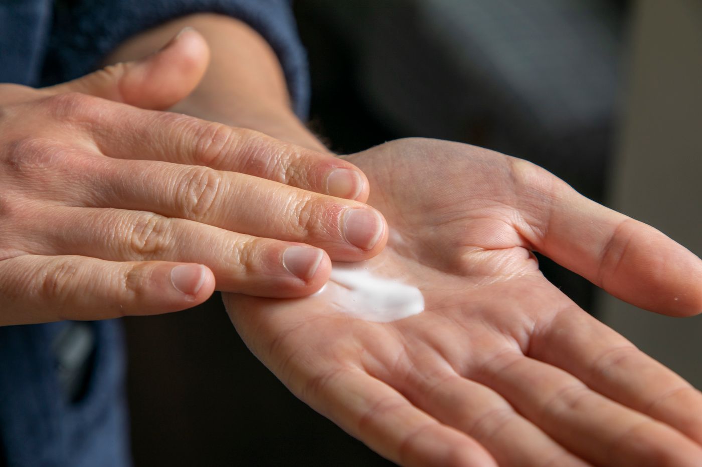 Close-up of lotion being applied to a palm