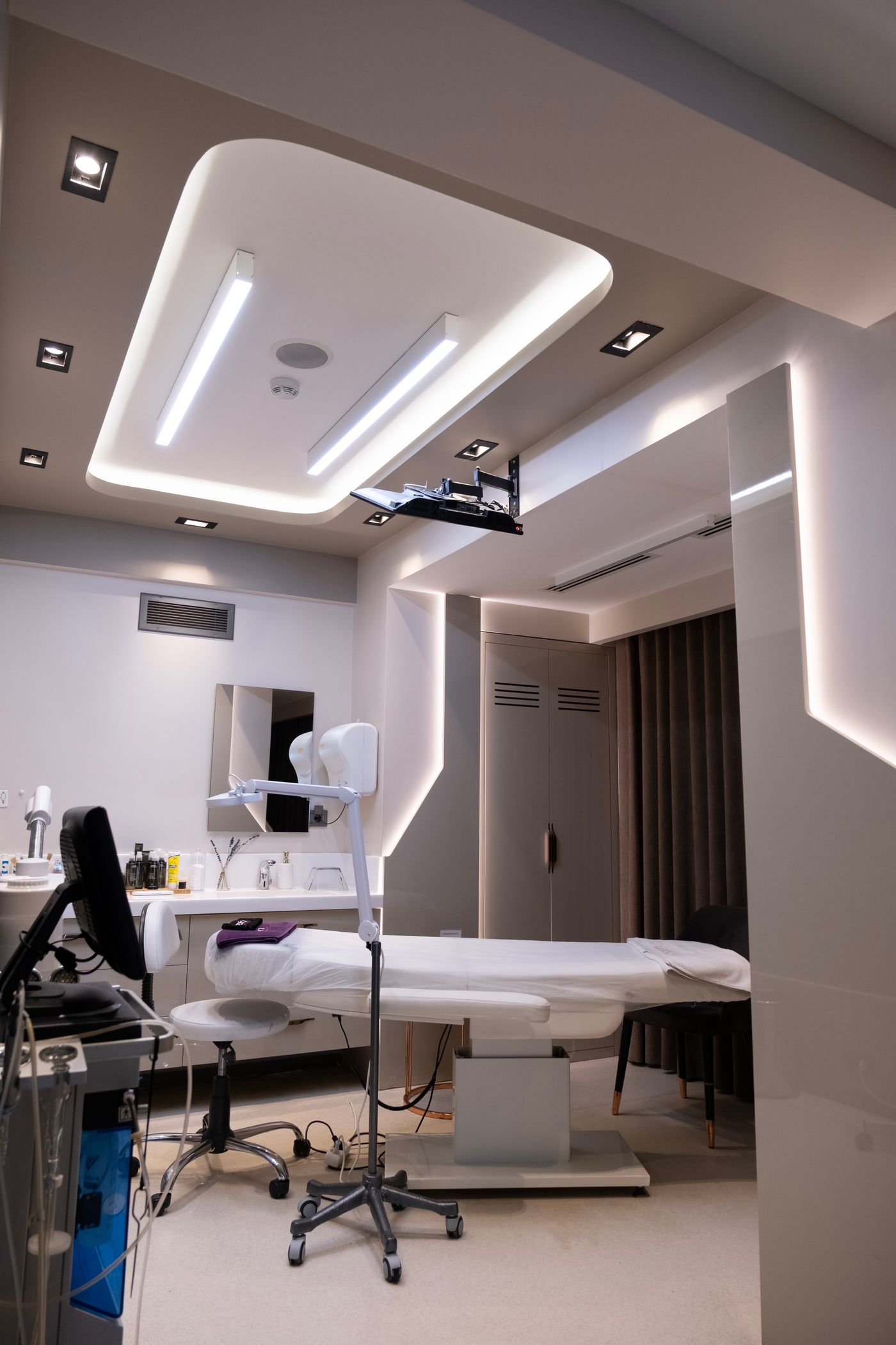 A modern clinical treatment room with professional equipment